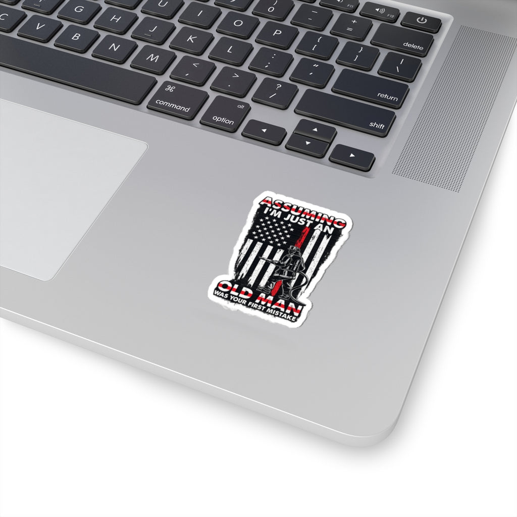 Sticker — “Assuming I’m Just an Old Man” Firefighter American Flag Kiss-Cut Sticker