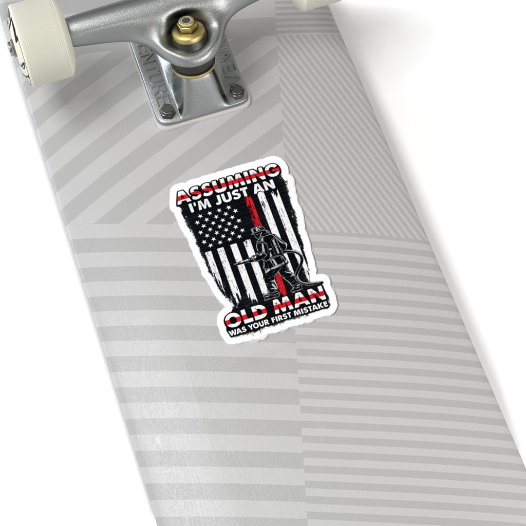 Sticker — “Assuming I’m Just an Old Man” Firefighter American Flag Kiss-Cut Sticker