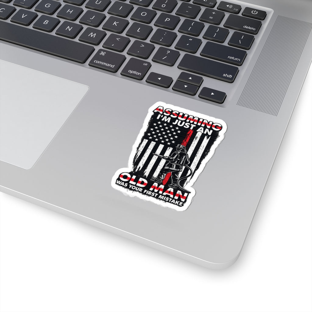 Sticker — “Assuming I’m Just an Old Man” Firefighter American Flag Kiss-Cut Sticker