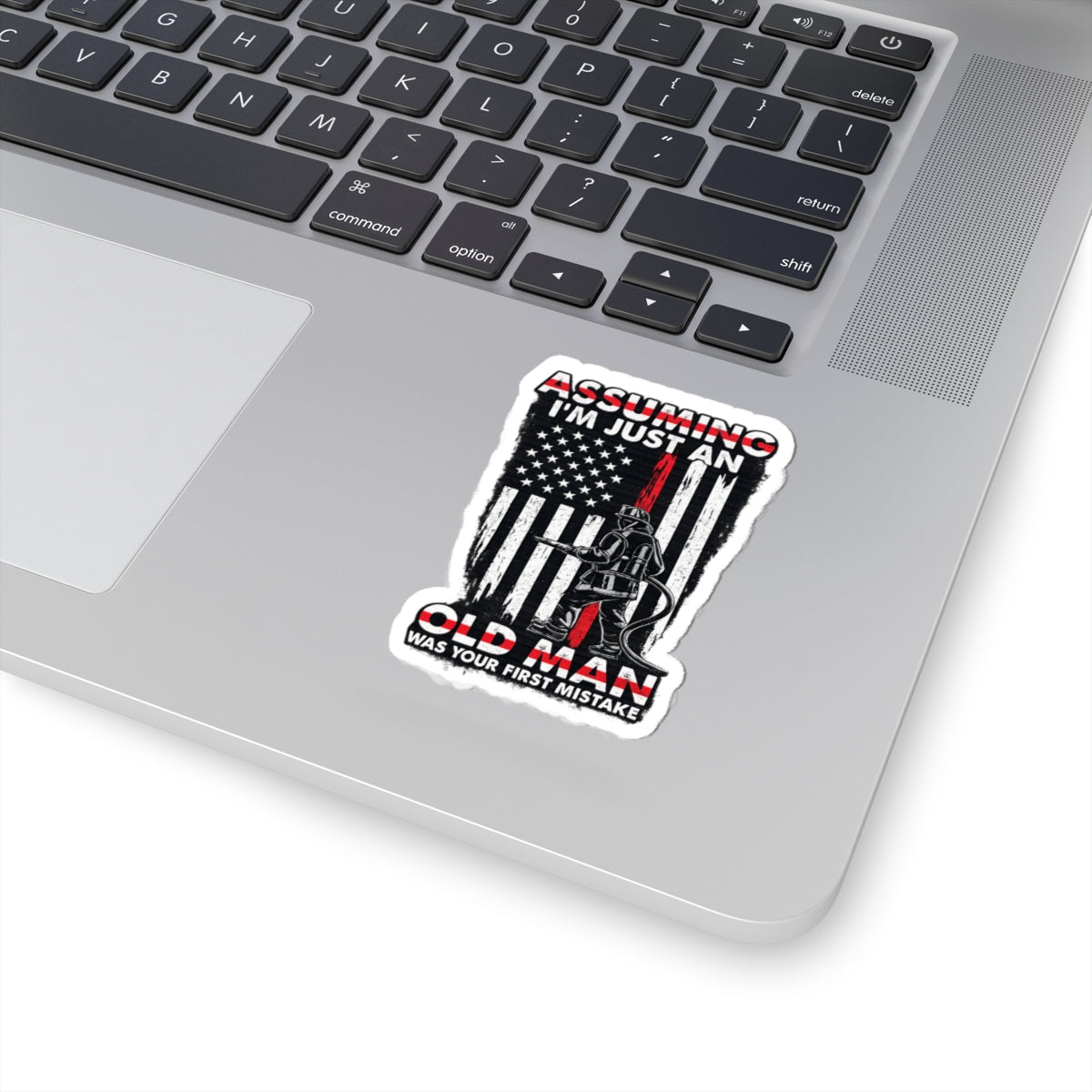 Sticker — “Assuming I’m Just an Old Man” Firefighter American Flag Kiss-Cut Sticker